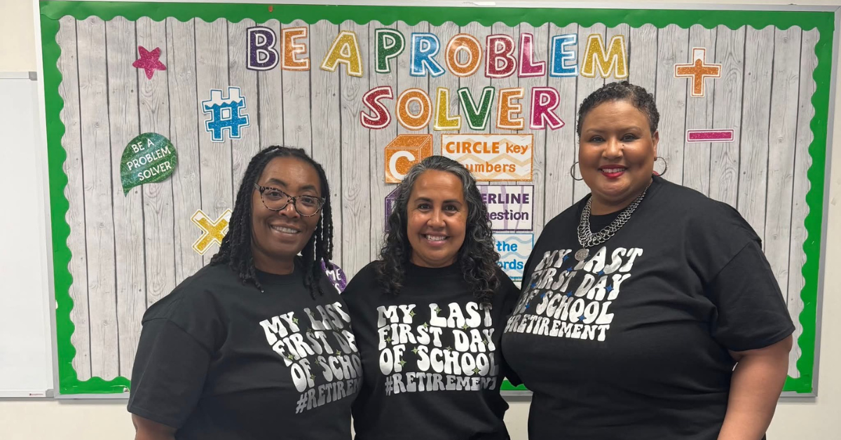 three teachers wearing black t shirts